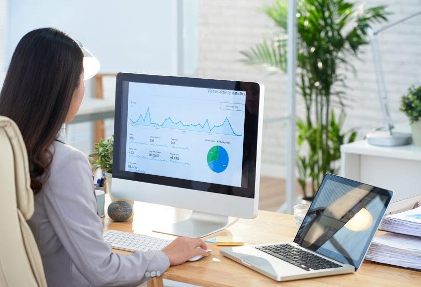 women working on project management software