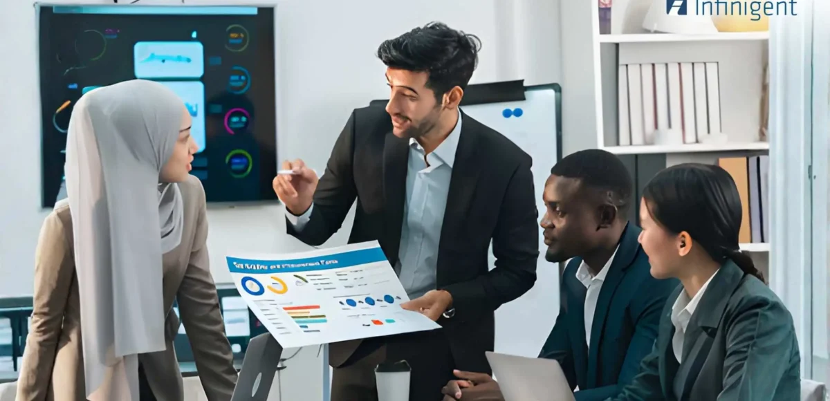 HR team discussing workforce analytics and compliance reports using HR software in a UAE office environment.