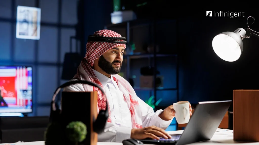 Business professional in UAE using payroll management software on a laptop to manage employee salaries and compliance