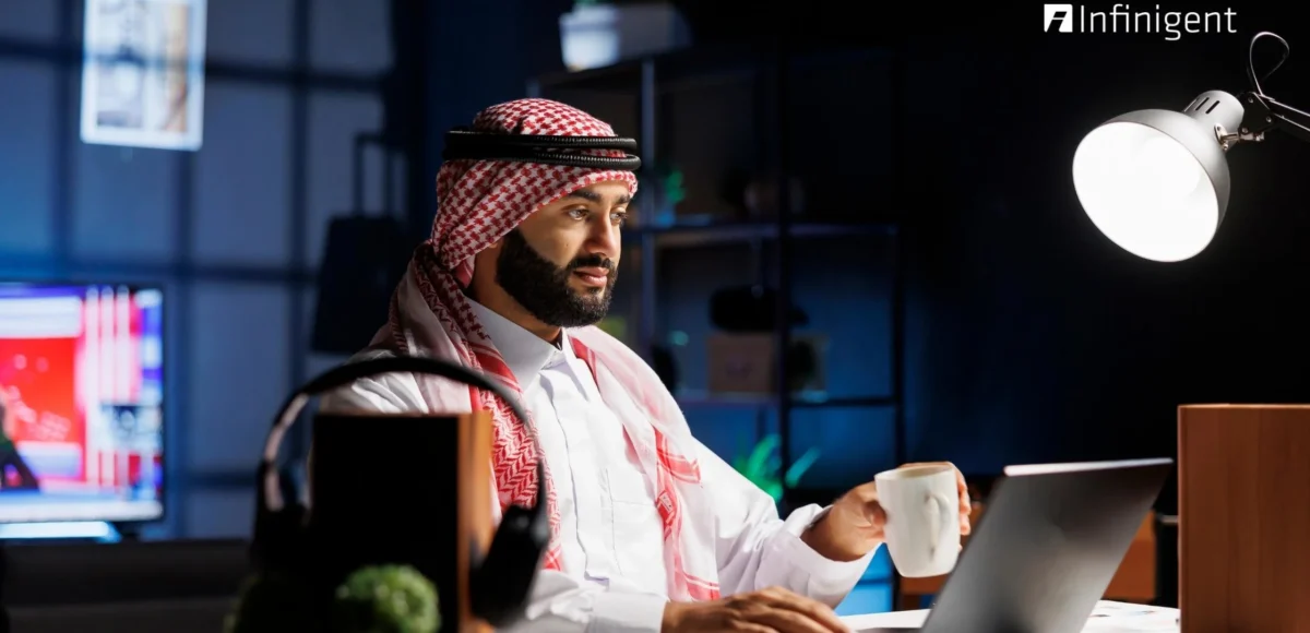 Business professional in UAE using payroll management software on a laptop to manage employee salaries and compliance