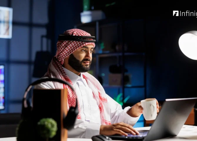 Business professional in UAE using payroll management software on a laptop to manage employee salaries and compliance