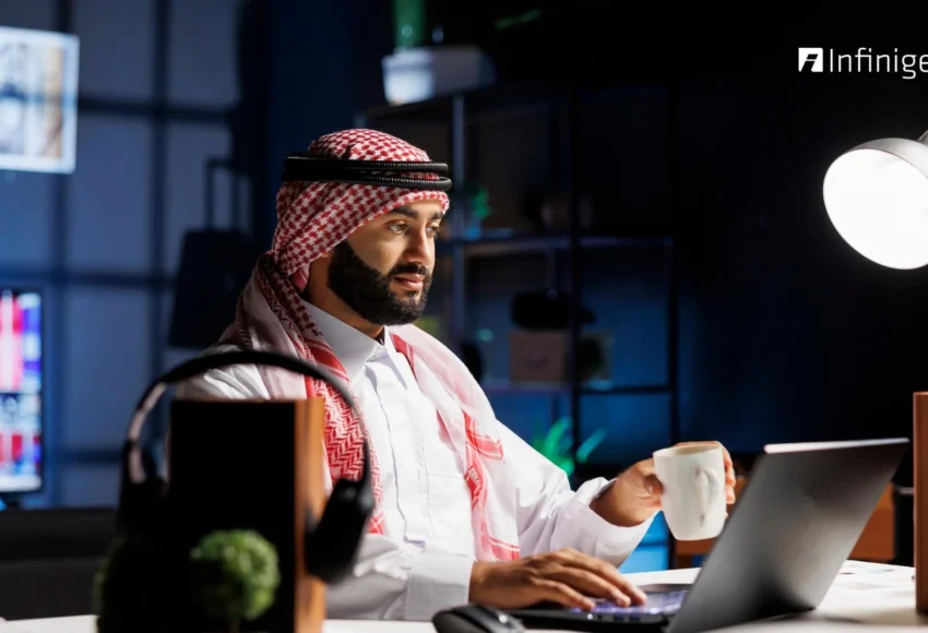 Business professional in UAE using payroll management software on a laptop to manage employee salaries and compliance